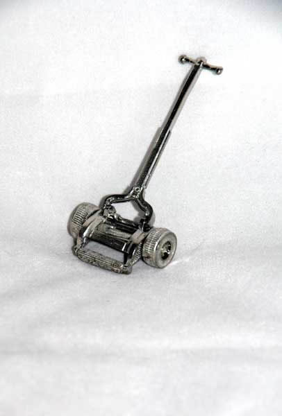 Old style lawn mower,  pewter