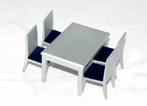 Silver table with 4 navy blue seated chairs