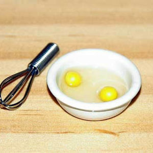 Eggs in bowl with beater