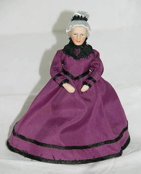 Mature lady doll in purple dress