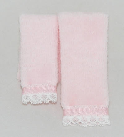 Pink folded pair of towels for the miniature dollhouse bathroom