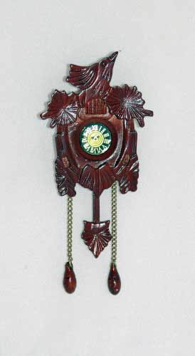 Mahogany wall clock with bird carving