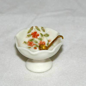 Punch bowl and gold serving spoon, porcelain