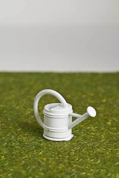White garden watering can