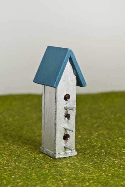 Bird house with blue roof