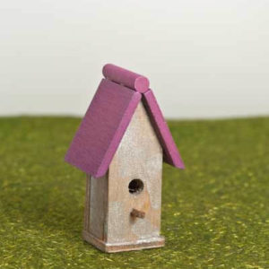 Bird house with pink roof