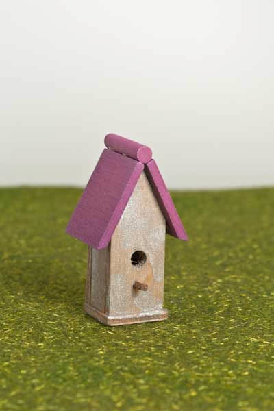Bird house with pink roof