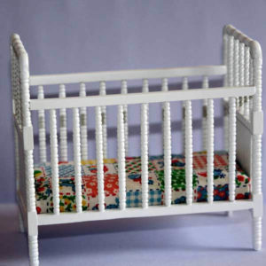 White spindle rail cot