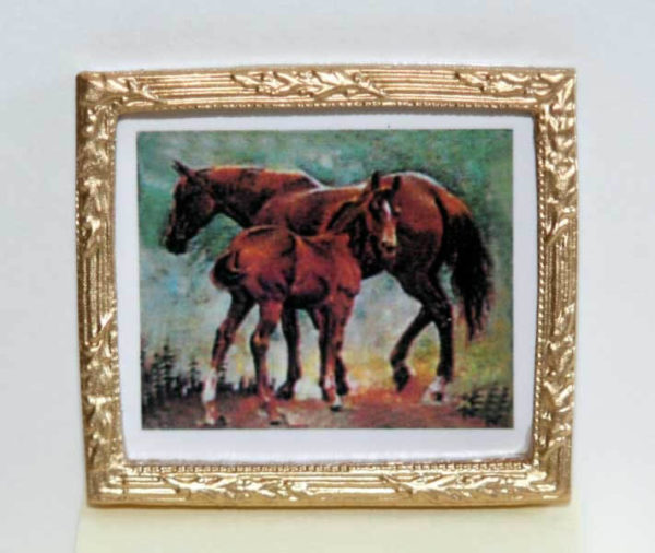 Gold framed picture of horses