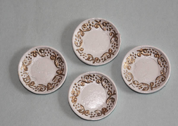 Plates, gold trim, set of four