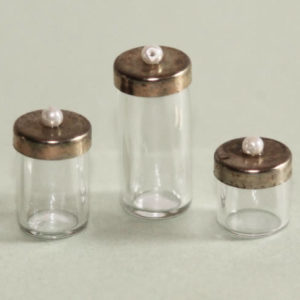 Glass canisters, brass lids