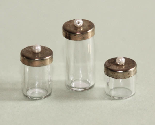 Glass canisters, brass lids