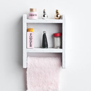 Stocked bathroom shelf