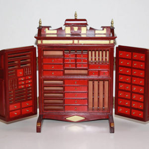 Collector's cabinet  mahogany with gold trim