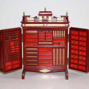 Collector's cabinet  mahogany with gold trim