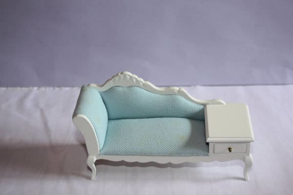 White chaise lounge with blue fabric top