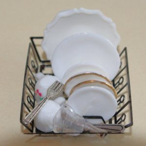 Black Wire Dish Drainer and White Dishes