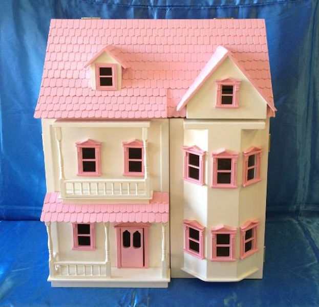 pink and white dolls house